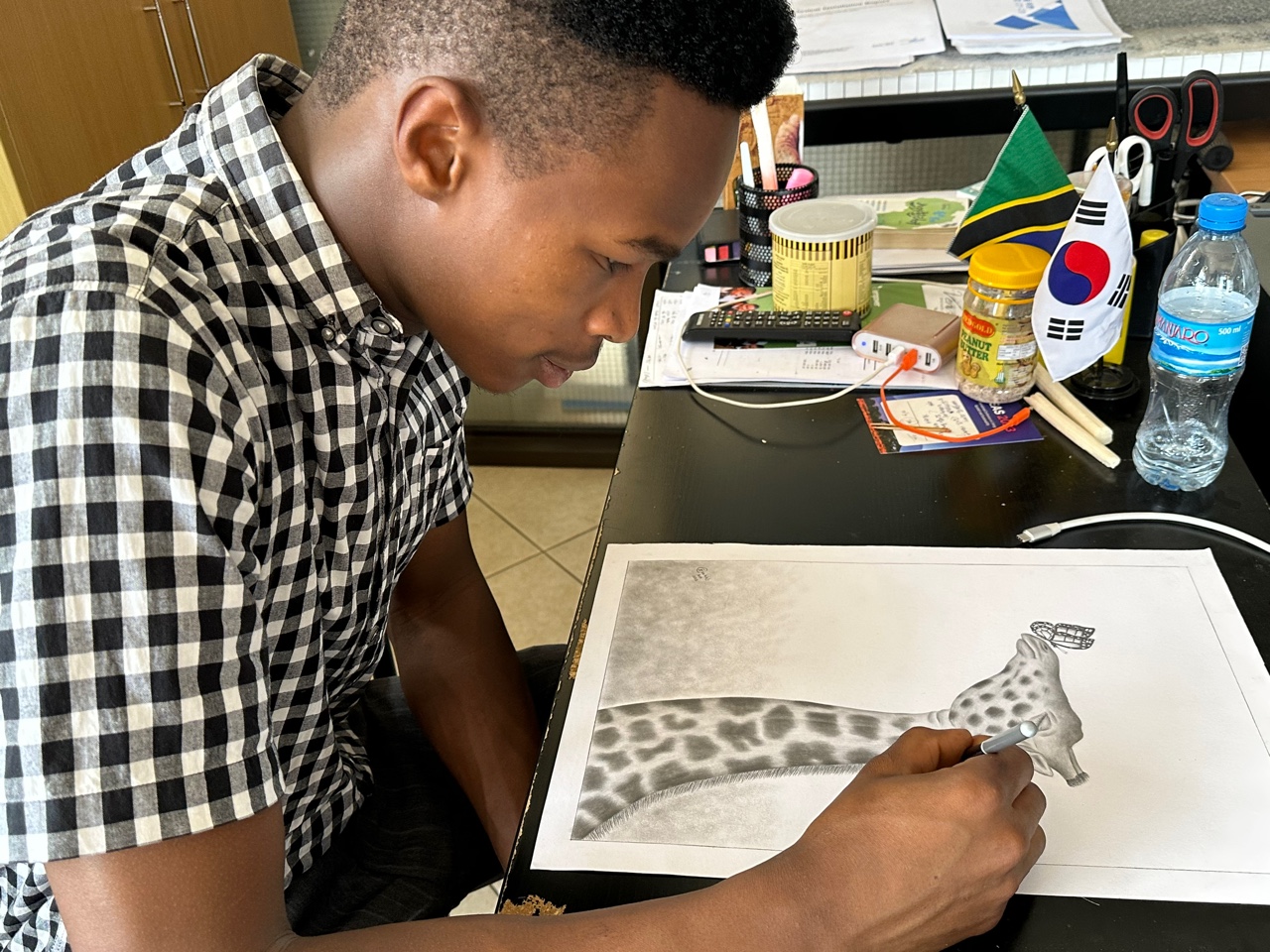 Ezekiel drawing a giraffe